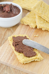 crackers spread with chocolate paste closeup