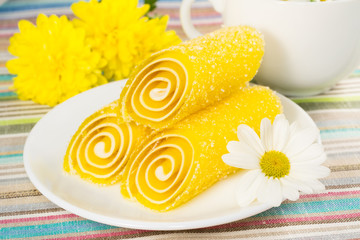 yellow candy fruit on a plate, closeup