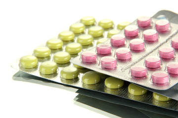 pills packed in blisters, isolated on white