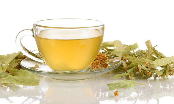 Glass cup of tea with linden isolated on white