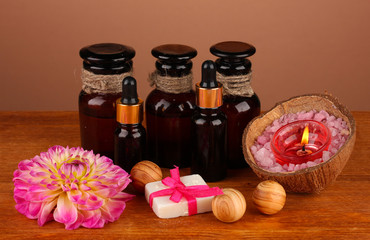 ingredients for soap making on brown background