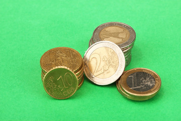 euro coins on color background