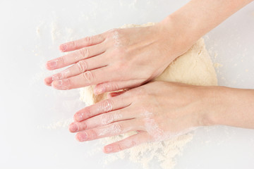 Preparing pizza dough isolated on white