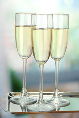 Corporate party: sparkling champagne glasses on tray