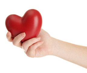 Red heart in woman hand, isolated on white