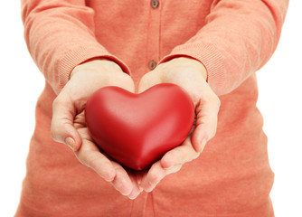 Fototapeta premium Red heart in woman hands, close up