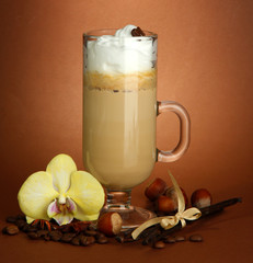 Fragrant coffee latte in glass cup with spices,