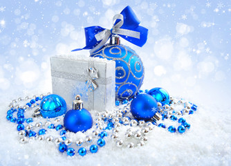 Christmas blue and silver decorations on snow
