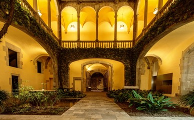 Quiet atrium with green plants with illumination