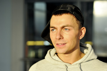 Obraz premium Portrait of the attractive young man in a sunlight