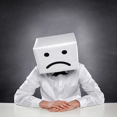 Unhappy Man with Box