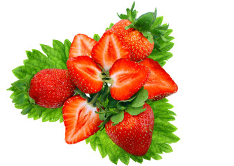 A heap of strawberries on green foliage. Isolated