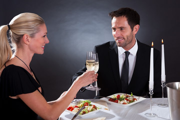 Romantic couple toasting each other