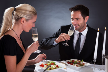Romantic couple toasting each other