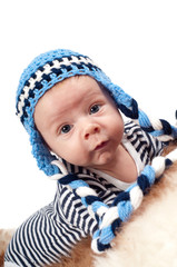 Newborn baby in blue hat