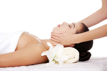 Obraz na płótnie Canvas Relaxed woman enjoy receiving face massage
