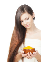 woman holding bowl of sea salt