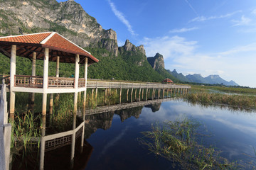 Classic wooden walkway on the lake in national park, Sam Roi Yod