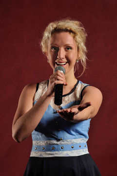 Woman singing in microphone