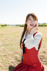 Beautiful asian woman using a cellular