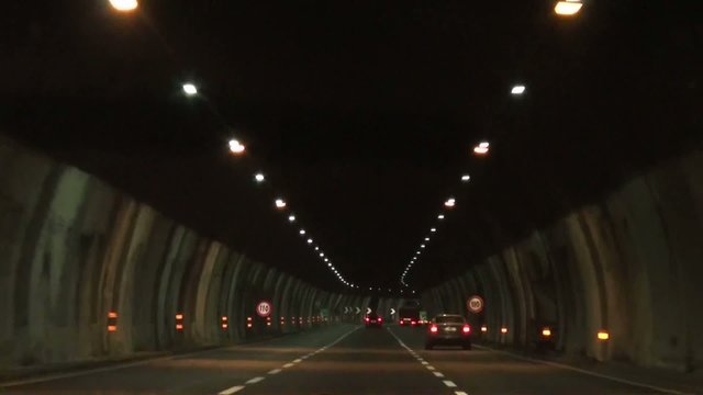 Automobile driving through tunnels
