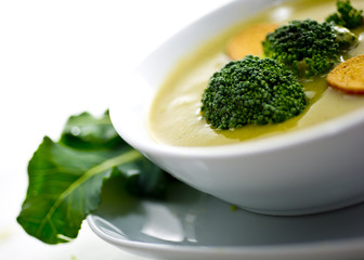 Cream soup with dried crusts isolated on white