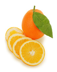 fresh ripe orange fruits with cut and green leaves isolated on w