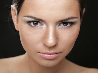 Obraz premium A portrait of a beautiful woman isolated on black background