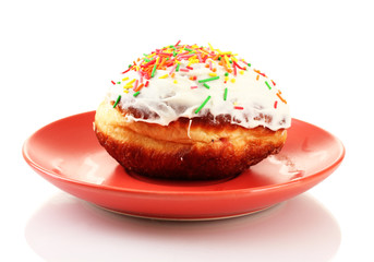 Tasty donut on color plate isolated on white