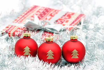 three red christmas ball and present