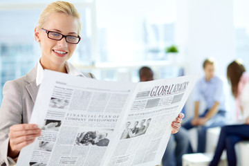 Woman with newspaper