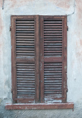 Fototapeta na wymiar Old Wooden Window in Milano italy