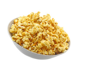 Bowl full of caramel popcorn isolated on white
