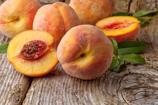 group of fresh peaches on wood  background