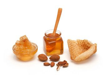 Honey, Honeycomb and almonds isolated