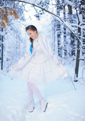beautiful girl in a winter forest
