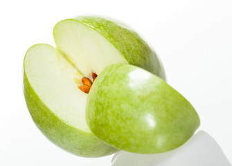 Sliced green apple on white background