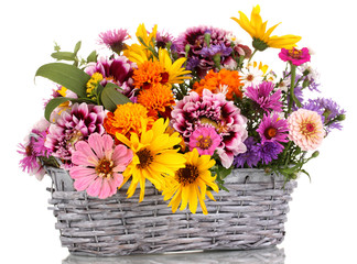 beautiful bouquet of bright flowers in basket isolated on white