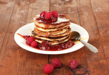 delicious sweet pancakes on wooden background