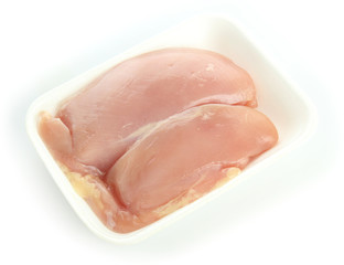 raw chicken meat in plastic tray isolated on white
