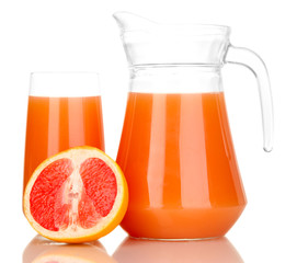 Full glass and jug of grapefruit juice and grapefruits isolated