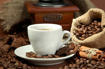 cup of coffee, grinder, turk and coffee beans