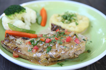 Grilled Porkchop on wood background