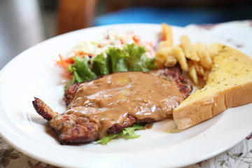 Grilled Porkchop on wood background