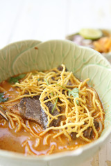 Noodle Khao soi , Thai food on wood background