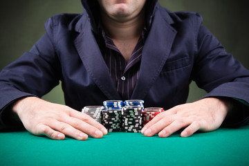 Poker player on black background