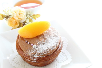 home bakery, chocolate pastry cake with peach on top