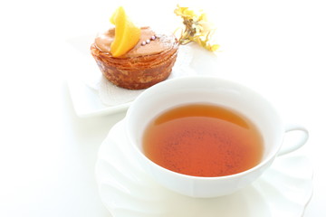English tea with pastry cake on background
