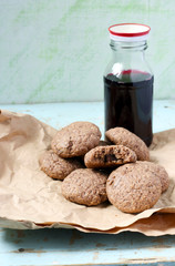 Chocolate chips oatmeal cookies and bottle of cherry juice