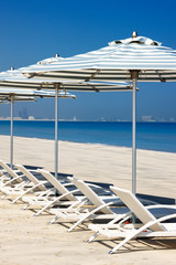 Reclining deck chairs on the beach